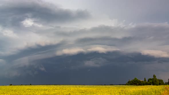 Dark storm clouds, rotating storm in Europe, climate change concept