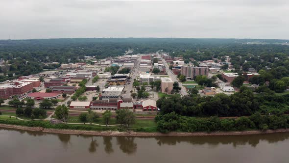 Elevating up over the Missouri River and Leavenworth Kansas Downtown