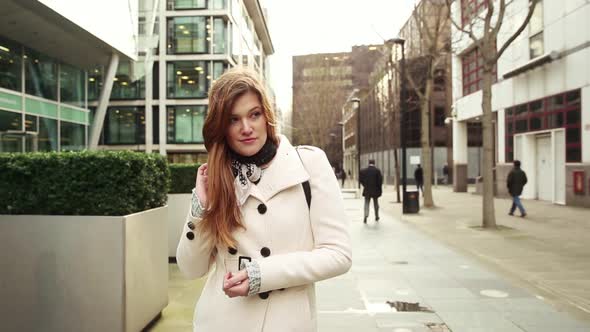 Portrait of a beautiful woman with hair tousled by the wind alt