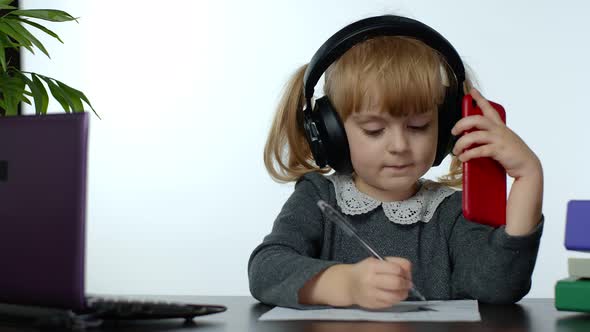 Preschool Child Girl Distance Online Learning at Home. Kid Studying Using Digital Mobile Phone alt