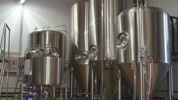 Storage Tanks In Brewery. Brewing Factory Indoors. Beer Factory