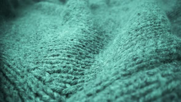 Extreme detail view of sheep wool cloth texture flowing in macro dolly shot. alt