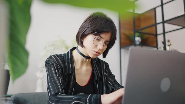 Stylish Brunette Girl Fashion Designer Works Remotely From Her Home alt