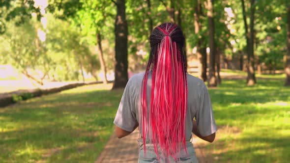 Female Rejoices About Good News Outdoors alt