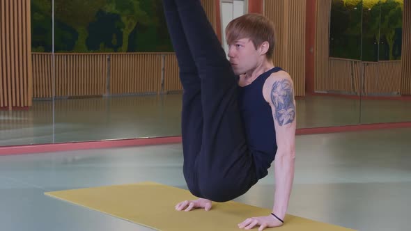 Yoga on a Mat in a Sports Studio