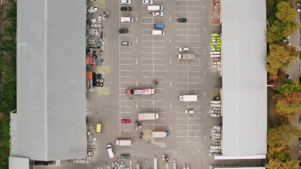 Parking on Construction Shopping Center with Many Cars and Trucks Aerial View alt