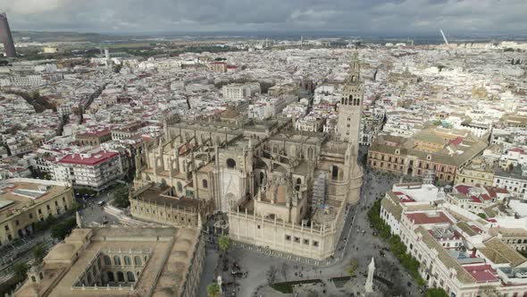Seville Cathedral and cityscape, Spain. Aerial circling