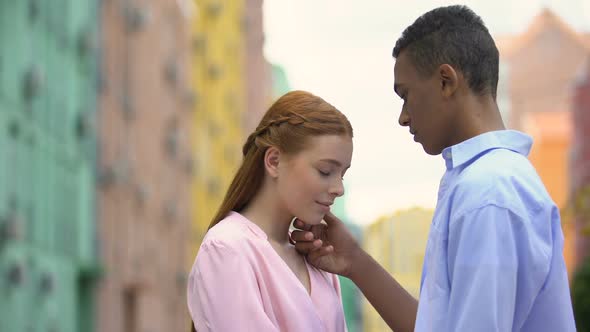 Boy Holding Chin of Girlfriend and Rising Her Head, Moment of First ...