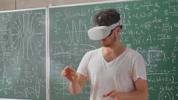 Portrait of Bearded Teacher Wearing Virtual Reality Headset in School Classroom alt