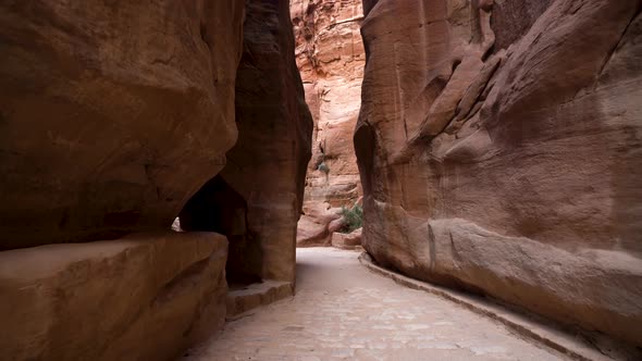 Walking Inside the Al Siq Canyon Towards The Treasury in Ancient City of Petra alt
