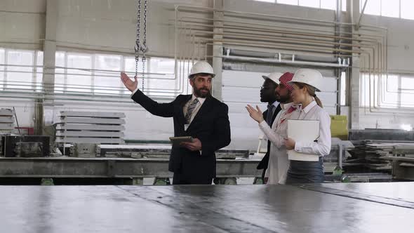 Businessman making a tour of the building for foreign partners