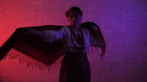 Ukrainian Women in National Dress Throws a Scarf Over Her Shoulders alt