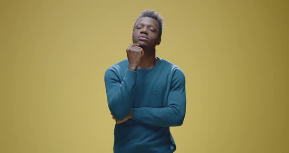 Pensive Man Touching Chin alt