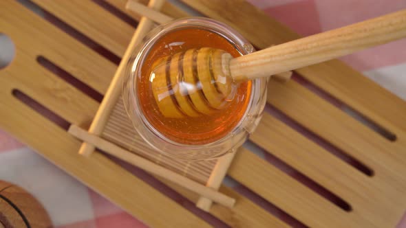 Wooden Ladle with Dripping Honey Close Up Beekeeping Products Based on the Concept of Organic alt