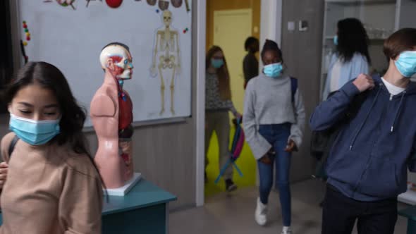 Teen Classmates in Face Masks Entering Classroom alt