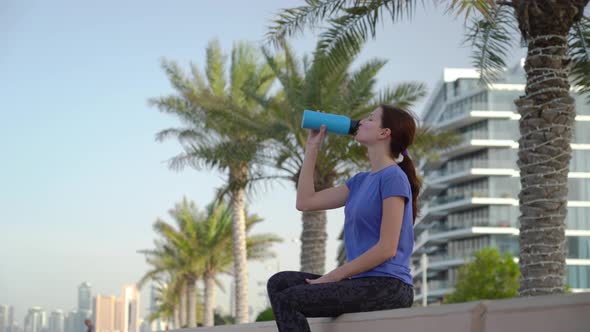 Girl Drinks Water After Running