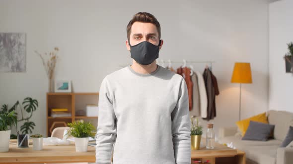 Man with Sign Stop Covid-19 alt