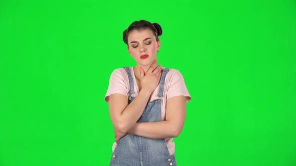 Girl Got a Cold, Sore Throat and Head, Cough on Green Screen at Studio alt