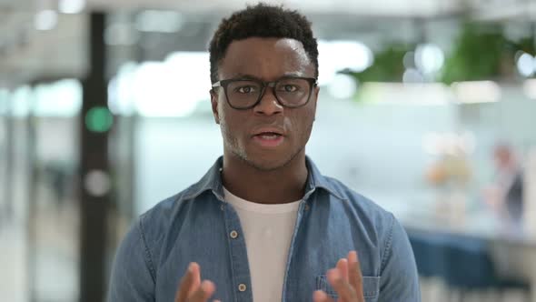 Portrait of Young African Man Feeling Shocked Surprised alt