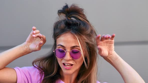 Fashionable Female Dancer in Pink Trendy Sunglasses Demonstrate Choreography alt