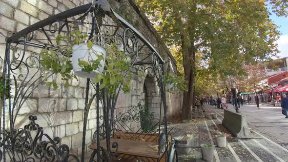 People strolling Rruga Murat Toptani. Pedestrian street in Tirana, Albania alt