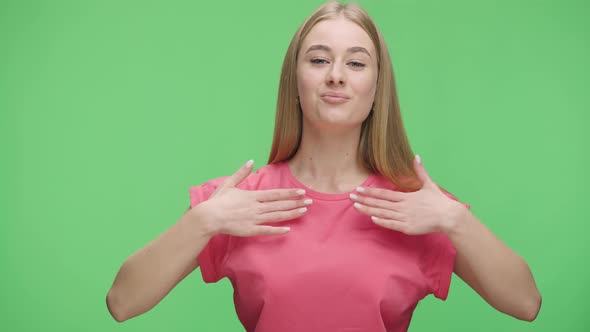 Portrait of a Young Girl Banging Her Fists on the Glass Waving Calling Someone and Gesturing Call Me alt