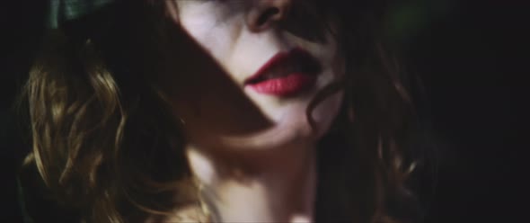 Young woman gazing in the forest alt