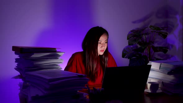 Stressed woman working at home at night