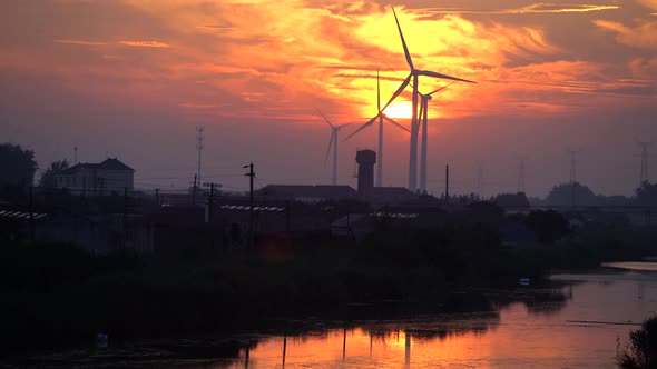 Wind Turbines at sunset alt