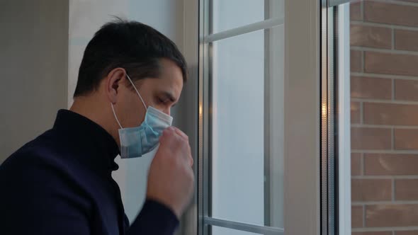 Man Puts on Medical Surgical Mask Before Going Out
