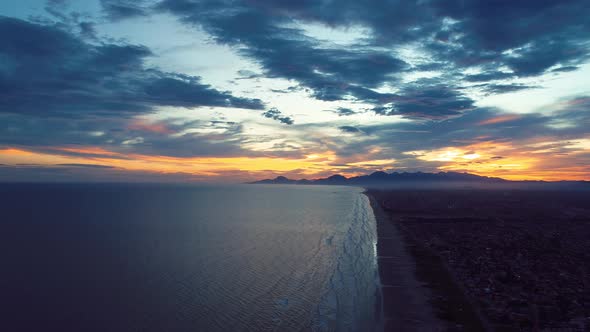 Vibrant sunset at Itanhaem Sao Paulo Brazil. Colorful tropical beach scenery. alt