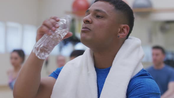 Man at gym takes a break