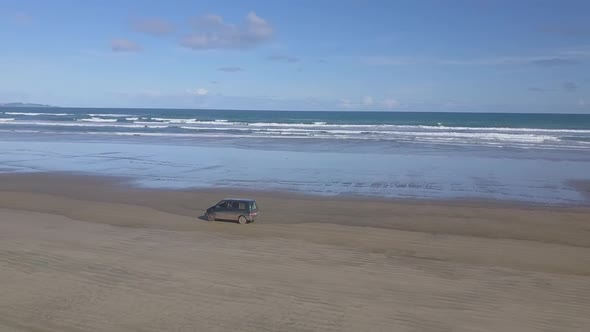 Aerial footage of driving on the beach