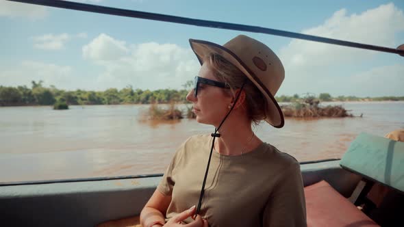 Safari Trip On Tanzania Selous. Tourist In Hat On African Safari Adventure On Holiday Vacation. alt