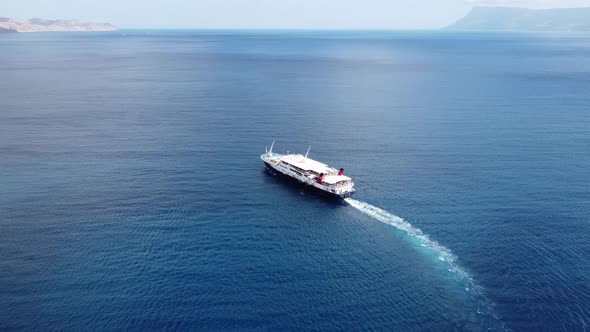 Passenger Ship Departing From Port with Destination Greek Islands alt