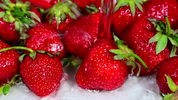 Washing Red Strawberry with Water alt