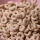 Close-up crispy rings fall into a pink plate - VideoHive Item for Sale