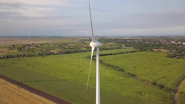 Aerial View of Wind Turbine Generators in Field Producing Clean Ecological Electricity alt