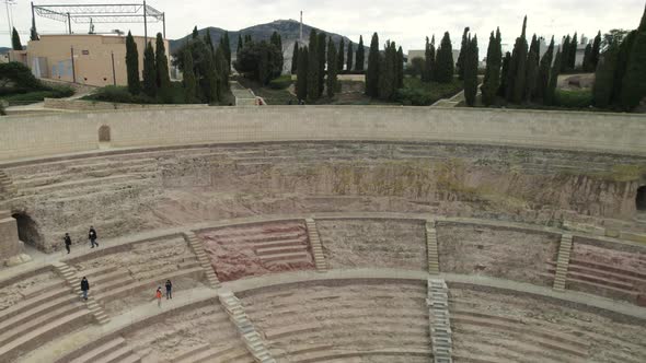 Ancient ruins of historic Roman amphitheater revealed; aerial pullback