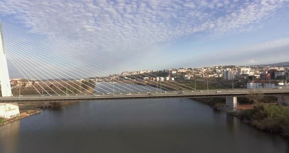 The Beautiful and Peaceful View Of Rainha Santa Isabel Bridge in Coimbra, Portugal - Aerial Shot alt