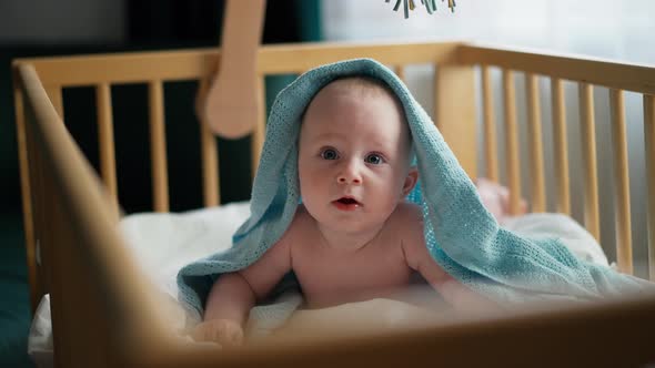 Baby Boy Toddler Crawling in Crib at Kids Nursery Room at Home alt