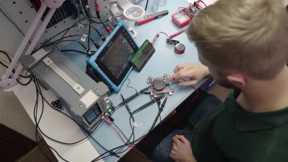 Young Electronic Developer Create Prototype of New Device and Measure Electronic Circuit Parameters