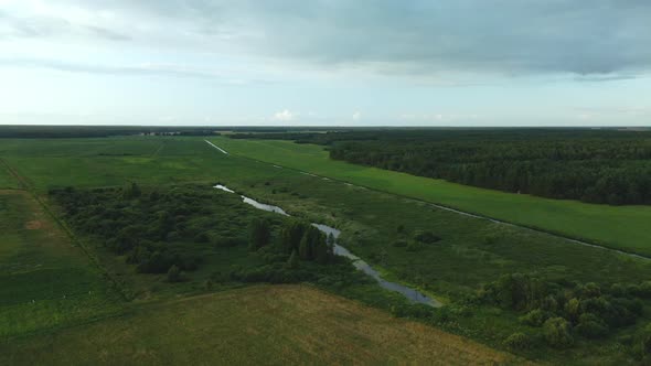 Rural Landscape. Green Forests And Fields. River Flows. Aerial Photography.