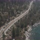 Aerial cinematic view mountain lake road. Road along mountains and lake. - VideoHive Item for Sale