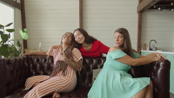 Multinational Women Making Peace Hugging and Continuing Friendship alt