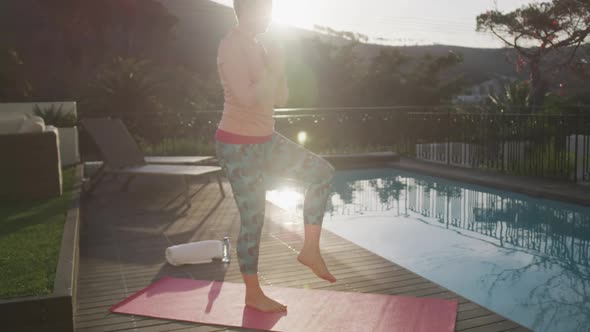 Senior woman outdoor yoga fitness alt