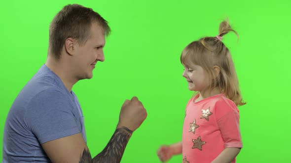 Father and Little Daughter Playing Rock Paper Scissors. Chroma Key. Leisure Game alt
