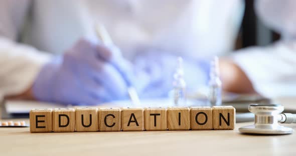 Doctor Makes Notes in Medical Documents at Teaching Lecture alt