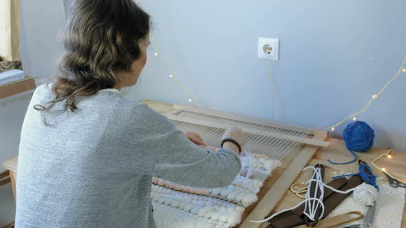 Weaving on a Loom. Young Woman Running on a Loom