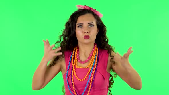 Displeased Woman Indignantly Talking To Someone, Looking at the Camera. Green Screen alt